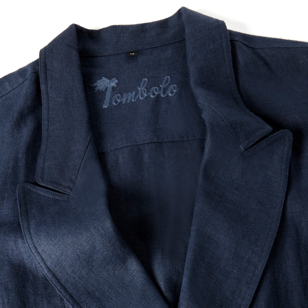 Close-up image of the stitched Tombolo logo on the inside of the jacket.