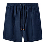 Front-facing image of a pair of navy linen shorts featuring an elastic waistband with a drawstring, side pockets, and wooden bead details on the drawstring ends.