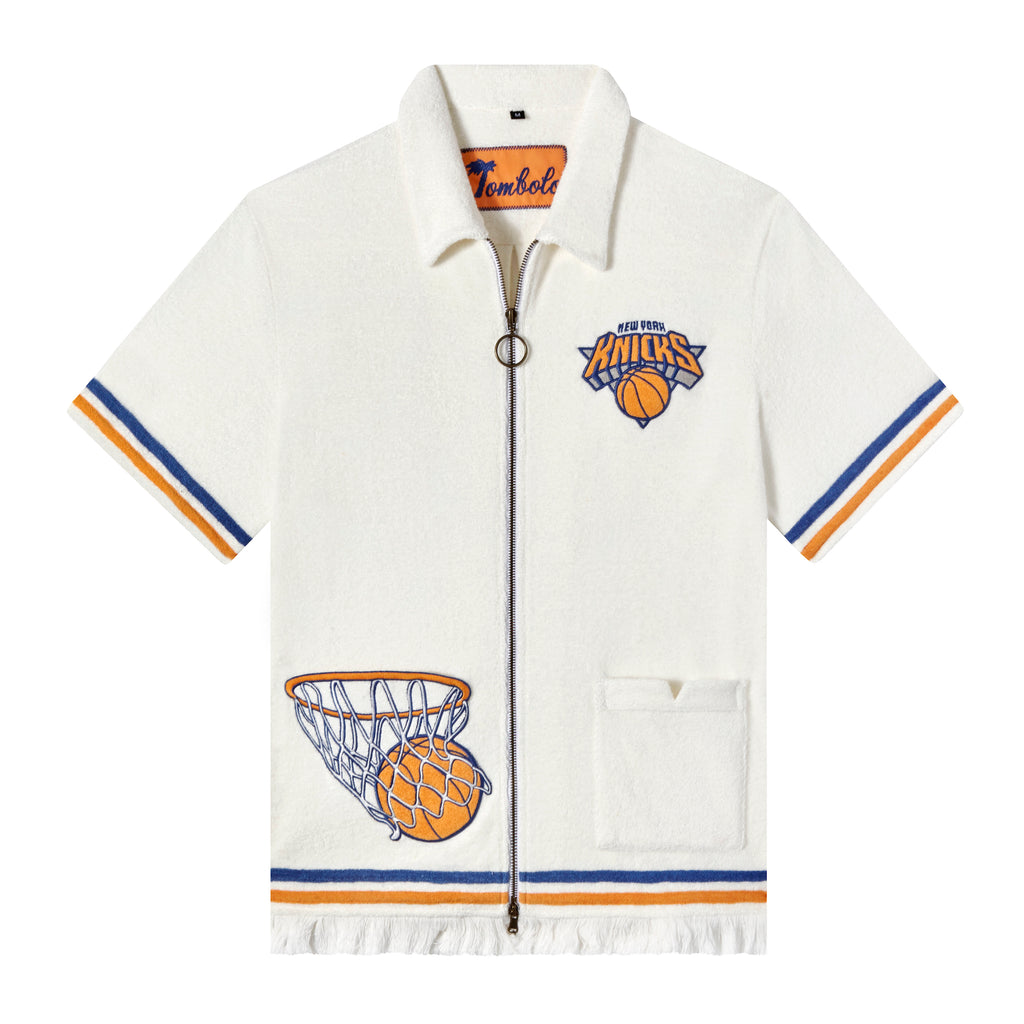 Tombolo x New York Knicks zip up Terrycloth shirt. Shirt is white with blue and orange stripes on edges.