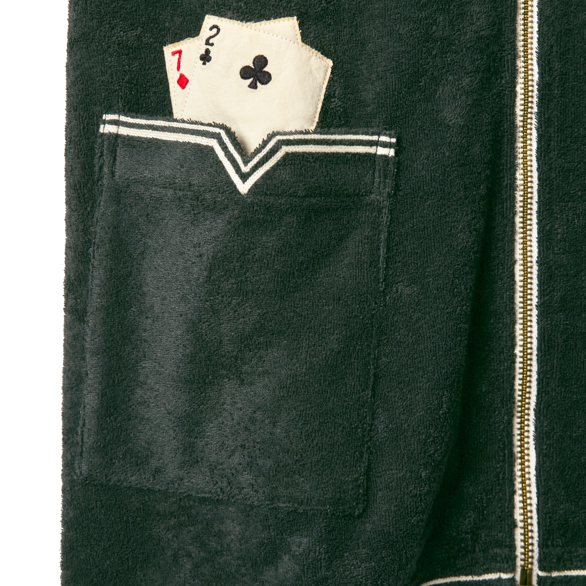 Close up of Wearer's Right Pocket, with 2 embroidered playing cards sticking out of the pocket. The cards are a 7 of diamonds and a 2 of clubs. 