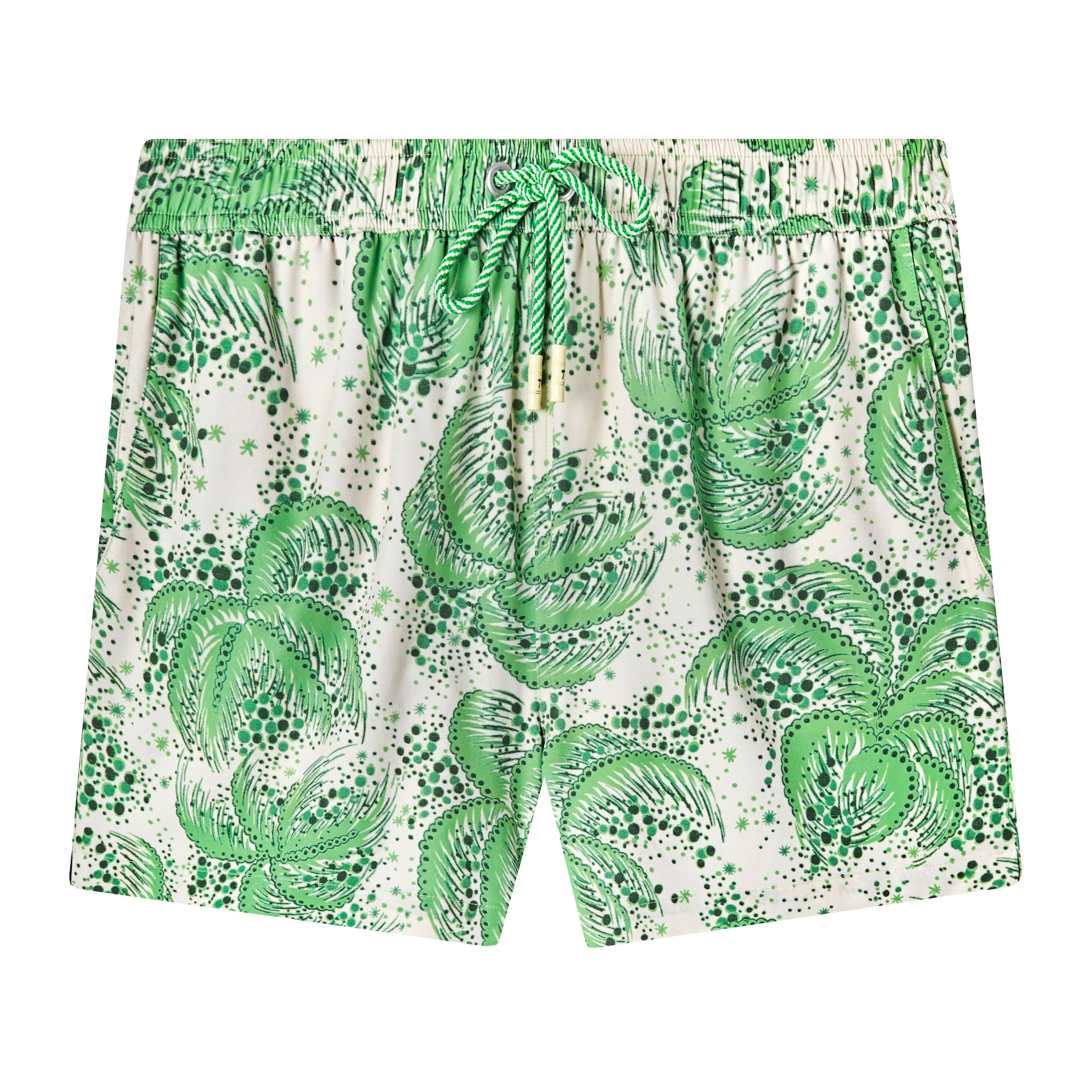 Front-facing product image of the 'Palm Fronds Swim Trunks (green)' that features a repeating vintage palm frond print throughout, zippered side pocket concealed on right side seam, and metal eyelet stoppers on green and white twist drawstrings.