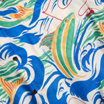 Detailed shot of the 'Perfect Cast' pattern featuring a yellow and green fish that appears to be jumping out of the water. 