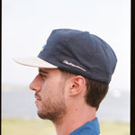 Man showing side profile of cap