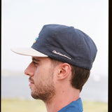 Man showing side profile of cap