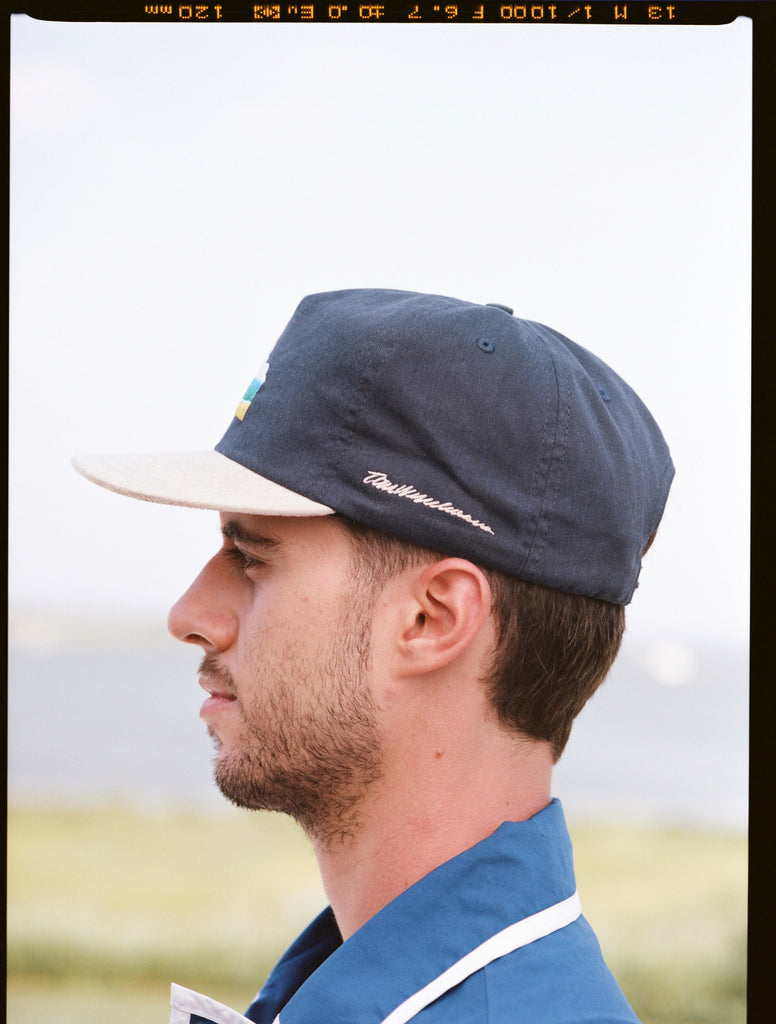 Man showing side profile of cap