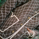 close up of jacket with one hand in pocket