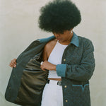 Woman shows inside lining of jacket