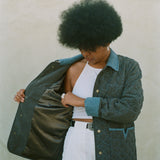 Woman shows inside lining of jacket