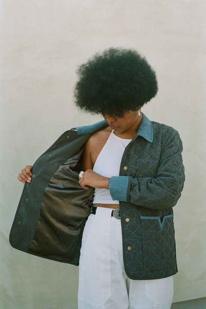 Woman shows inside lining of jacket