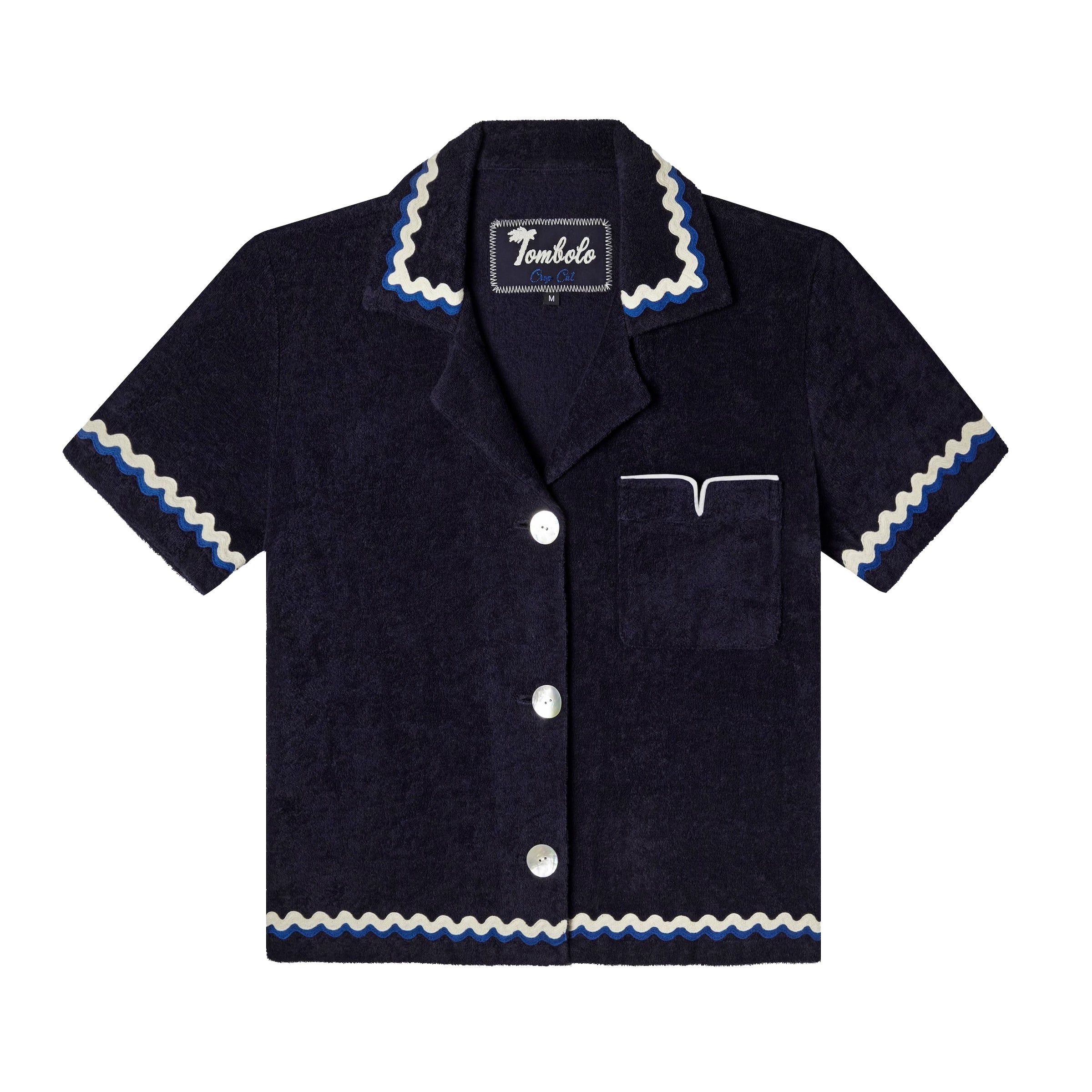 Front-facing product image of the 'Rick Rack' Cabana ~ Crop Cut (Midnight Blue) made of Organic Cotton Terry Cloth and featuring and featuring oversized agoya shell buttons, signature Tombolo v-slit pocket on chest, overlapping rick rack embroidery on collar, cuffs, and bottom sweep, and a custom woven Tombolo label.
