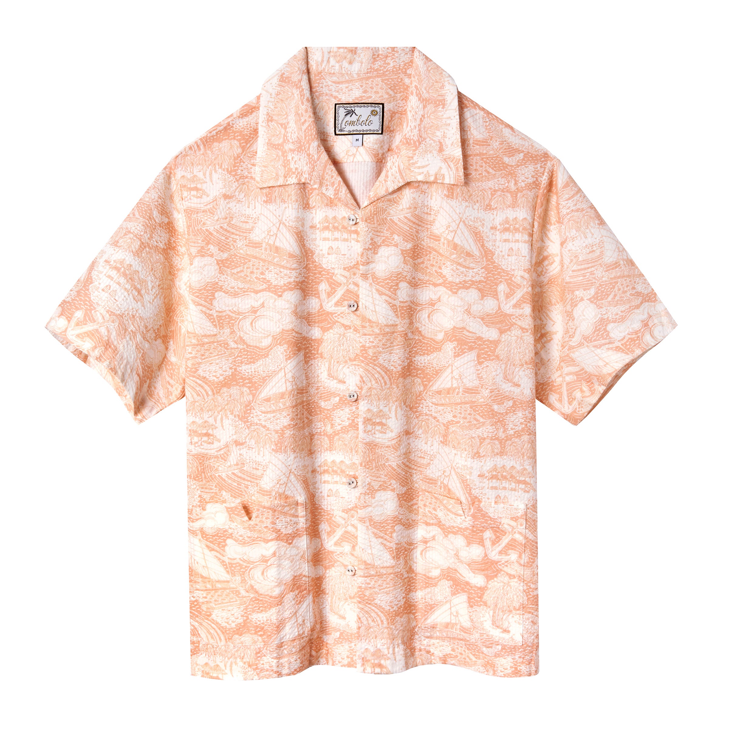 Front-facing product image of the 'Voyage Shirt' in coral seersucker made of organic cotton that features front pockets with signature Tombolo 'v'-slit pocket openings, matching self-covered buttons with loop closures, vintage artwork depicting a sailor's voyage, shot on a white background.