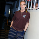 SNL Costume Designer, Tom Broecker, seen wearing the SNL 'Tompolo' with Easy Going Striped Navy pants, and his hands in pocket. 