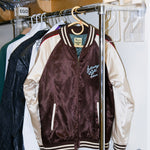 SNL satin Souvenir Jacket is seen hanging in an SNL dressing room. 
