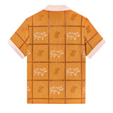 Backwards-facing product image of 'The Sopranos' Satriale's (Pruh-Zhoot) showcasing the pig embroidery on alternating panels, labeled with various cuts in Sopranos parlance: "gabagool", "pruh-zhoot", etc, and square panels joined by ‘ladder’ lace embroidery