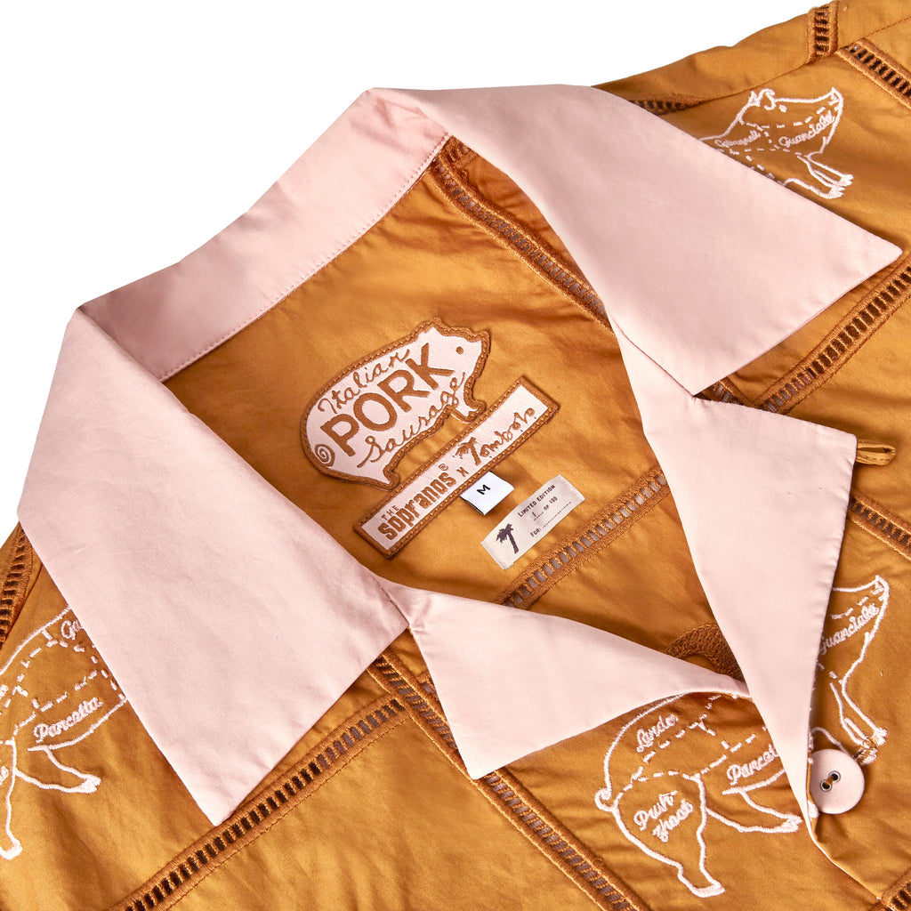 Close-up image of 'The Sopranos' Satriale's (Pruh-Zhoot) that showcases the Custom woven 'The Sopranos' x Tombolo interior label, including special pig logo from Satriale's storefront and a "Limited Edition: x of 100" interior tag.