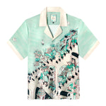 Tombolo silk shirt in collaboration with Lucio Liguori, depicting an artistic representation of a bustling Positano street scene 