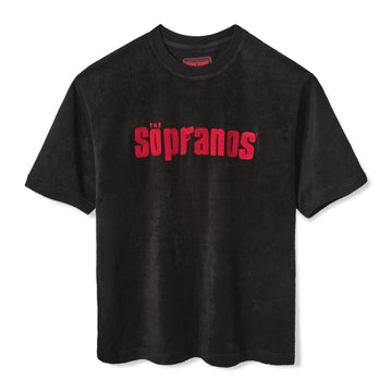 Front-facing product image of 'The Sopranos' Souvenir Terry Tee that features a red chain-stitched 'The Sopranos' logo across chest and a custom woven 'The Sopranos x Tombolo' interior label, all of which is made in terrycloth, shot on a white background.