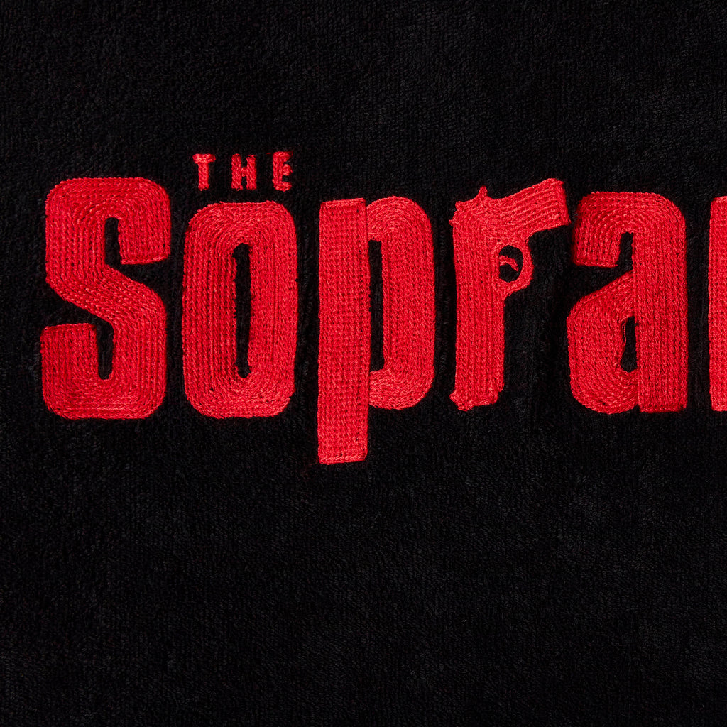 Close-up image of 'The Sopranos' Souvenir Terry Tee's red chain-stitched 'The Sopranos' logo across chest.