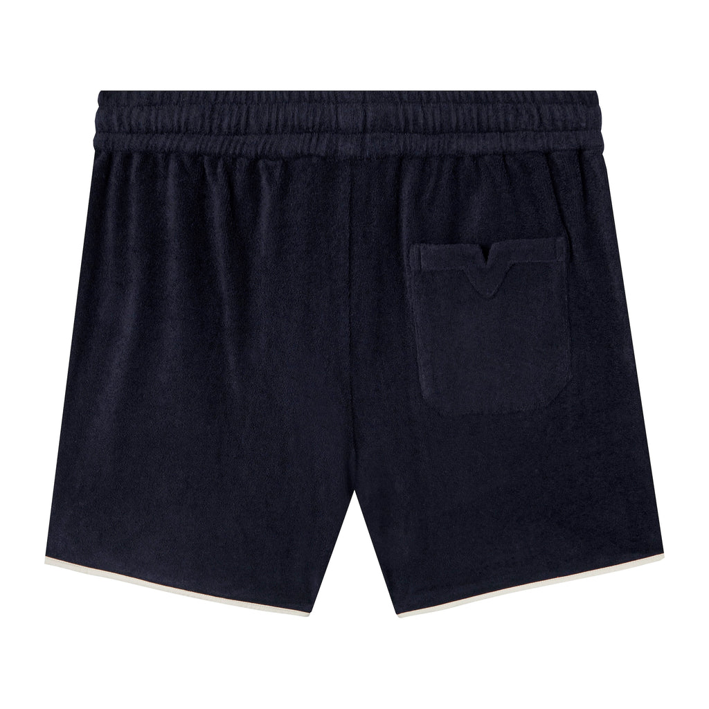 Backwards-facing product image of the 'Standard Issue' Cabana Shorts (Midnight Blue) that showcases the signature Tombolo 'V' Slit on the backpocket.