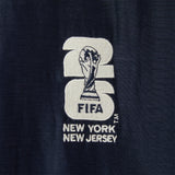 Embroidered FIFA logo on a navy fabric.