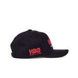 'The Sopranos' 25th Anniversary 5-Panel Souvenir Cap with HBO Logo in red text and the words "It's not TV. It's HBO" also written in red lettering below.