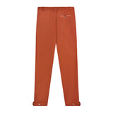 Back view of rust traveler pants.
