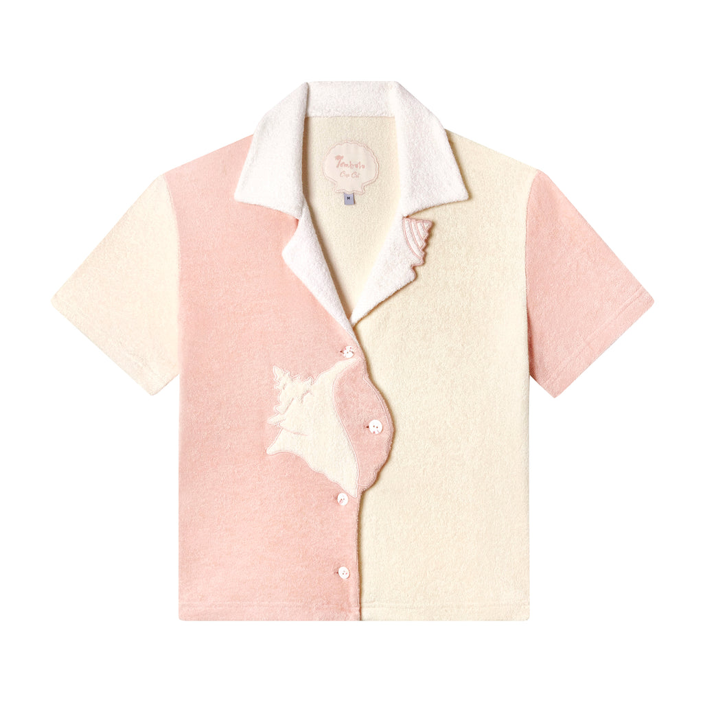 Layflat of conched out shirt on white background