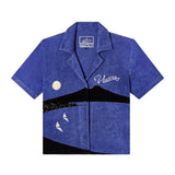 Front-facing product image for the 'The Sopranos' Vesuvio Cabana ~ Crop Cut that features a predominately blue terrycloth color with an outline of Mt. Vesuvius, the moon, distant city light, and two sailboats on white background.