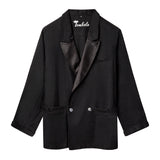 Black double-breasted jacket with satin shawl lapel, two front pockets, and a relaxed fit.