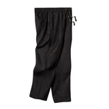 Black linen drawstring pants with a relaxed fit, elastic waistband, and side pockets