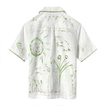 Image of backside of white button down, featuring more green floral and abstract designs. 