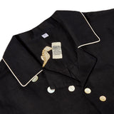 Closeup of 'Tip Your Bartenders!' Cabana's interior label with an embroidered seahorse beneath the collar. The woven label inside the shirt reads: Label reads "Cocktail Menu: Tombolo's. No Reservations. Cash only. 6 drink minimum. 1 hour maximum. Service included. Extra gratuity MANDATORY"