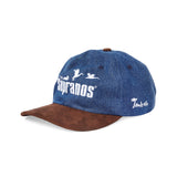 Side-facing product image of 'The Sopranos' Fowl Play 6-Panel Souvenir Cap that features a 'Tombolo' logo on the wearer's left side