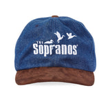 Front-facing product image of 'The Sopranos' Fowl Play 6-Panel Souvenir Cap made of 100% Cotton Indigo Denim (8oz) (body) and Polyester Suede (brim) that features 'The Sopranos' logo.