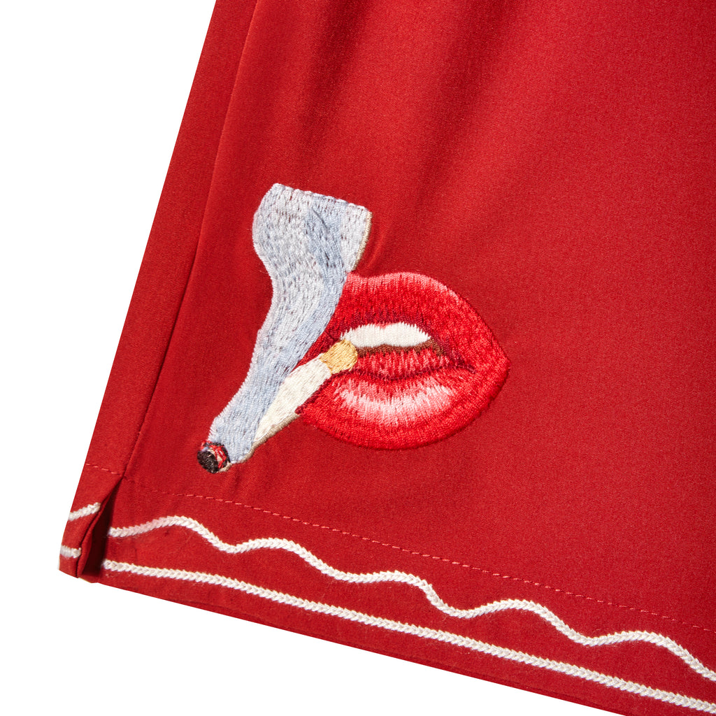 Close up of embroidered smoking lips motif