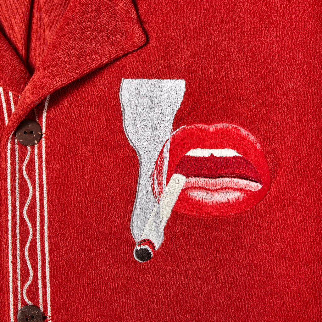 close up of embroidered smoking lips motif