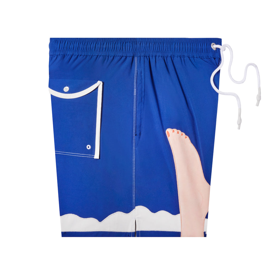 Side shot of swim trunks showing foot motif, back pocket and concealed zippered side pocket