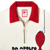 Close up of metal zipper, red terry cloth collar and interior label showing Da Adolfo x Tombolo collab