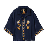 Navy blue shirt with gold mermaid and starfish designs on a white background