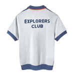 Back view of a short-sleeved terry cloth shirt in white with blue trim. The words “EXPLORERS CLUB” are appliquéd in bold blue letters across the upper back.