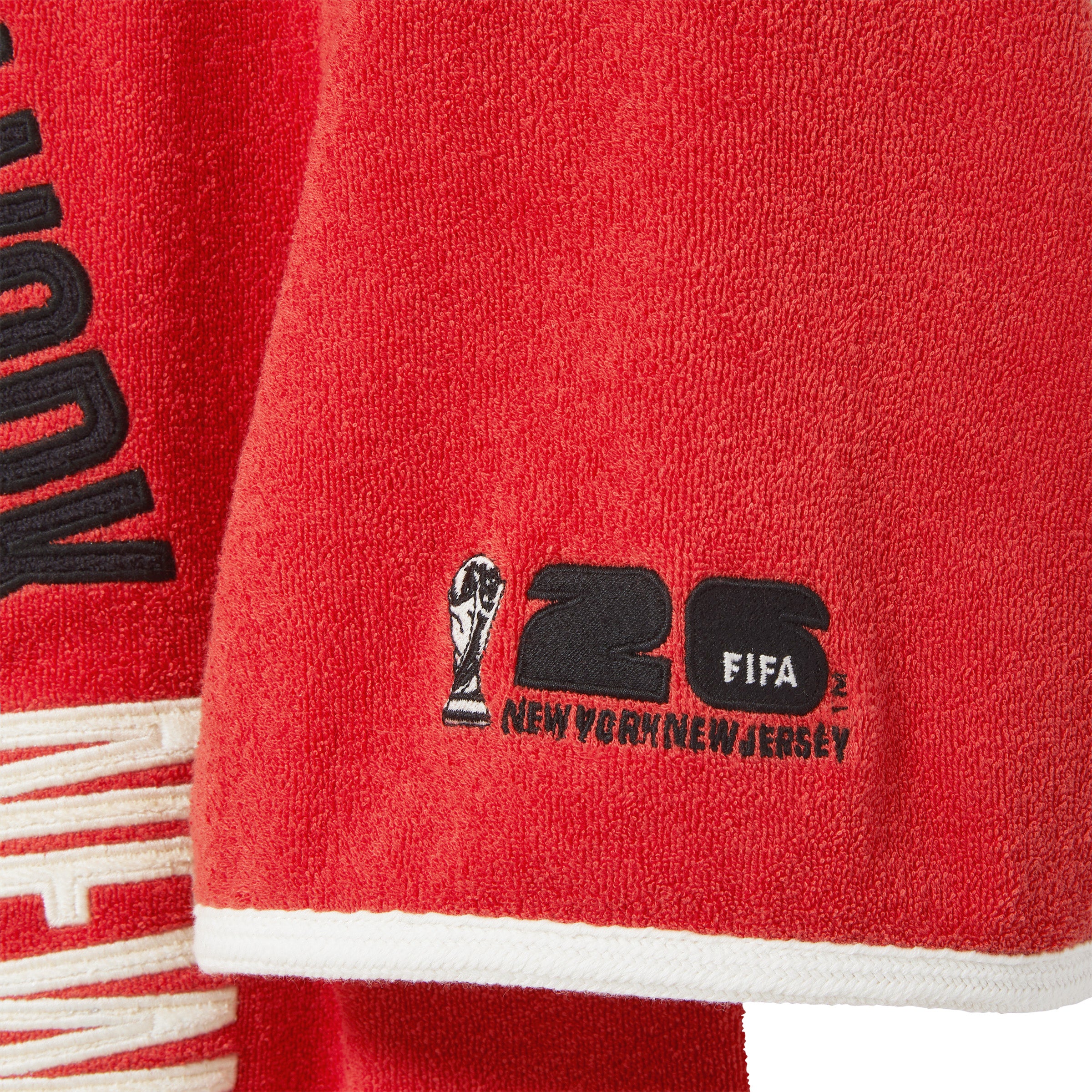 Close-up of FIFA 26 logo on wearer's sleeve.