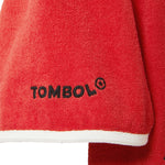 Close-up of red cabana with 'Tombolo' logo on one of the sleeves. 