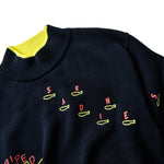 Detail shot of the "sardine" embroidery.