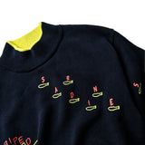 Detail shot of the "sardine" embroidery.