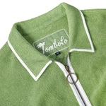 Close-up product image of the 'Standard Issue' Cabana's (green)chain-stitched interior label and antique ring-pull two-way brass zipper.