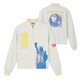 Front and back view of a cream terry long-sleeve quarter-zip featuring striped rib-knit collar and cuffs, embroidered FIFA World Cup 26 New York/New Jersey crest, oversized Statue of Liberty graphic, Tombolo sleeve detail, and a back graphic of a globe-shaped soccer ball.