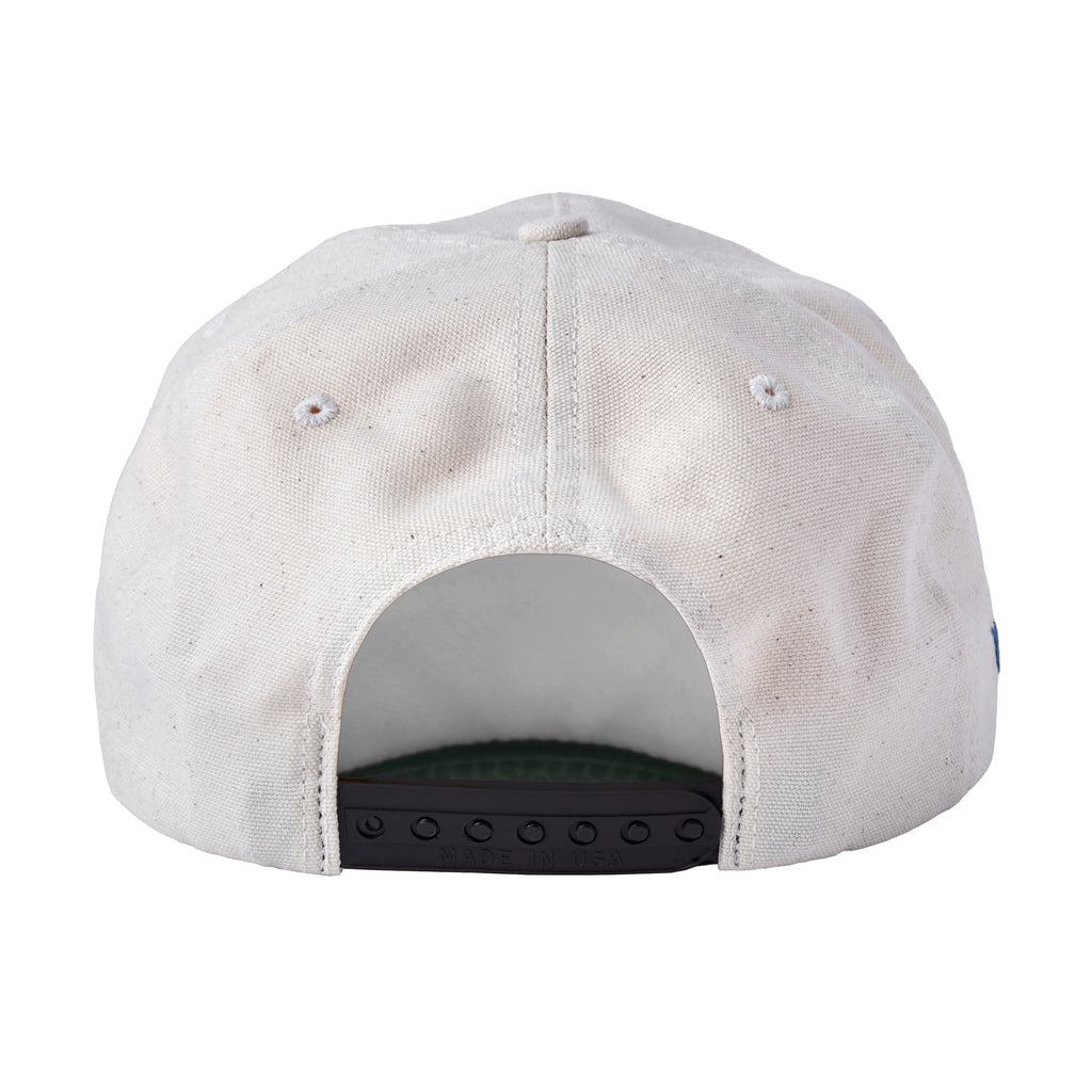Back view of a beige canvas baseball cap with an adjustable black snapback closure.