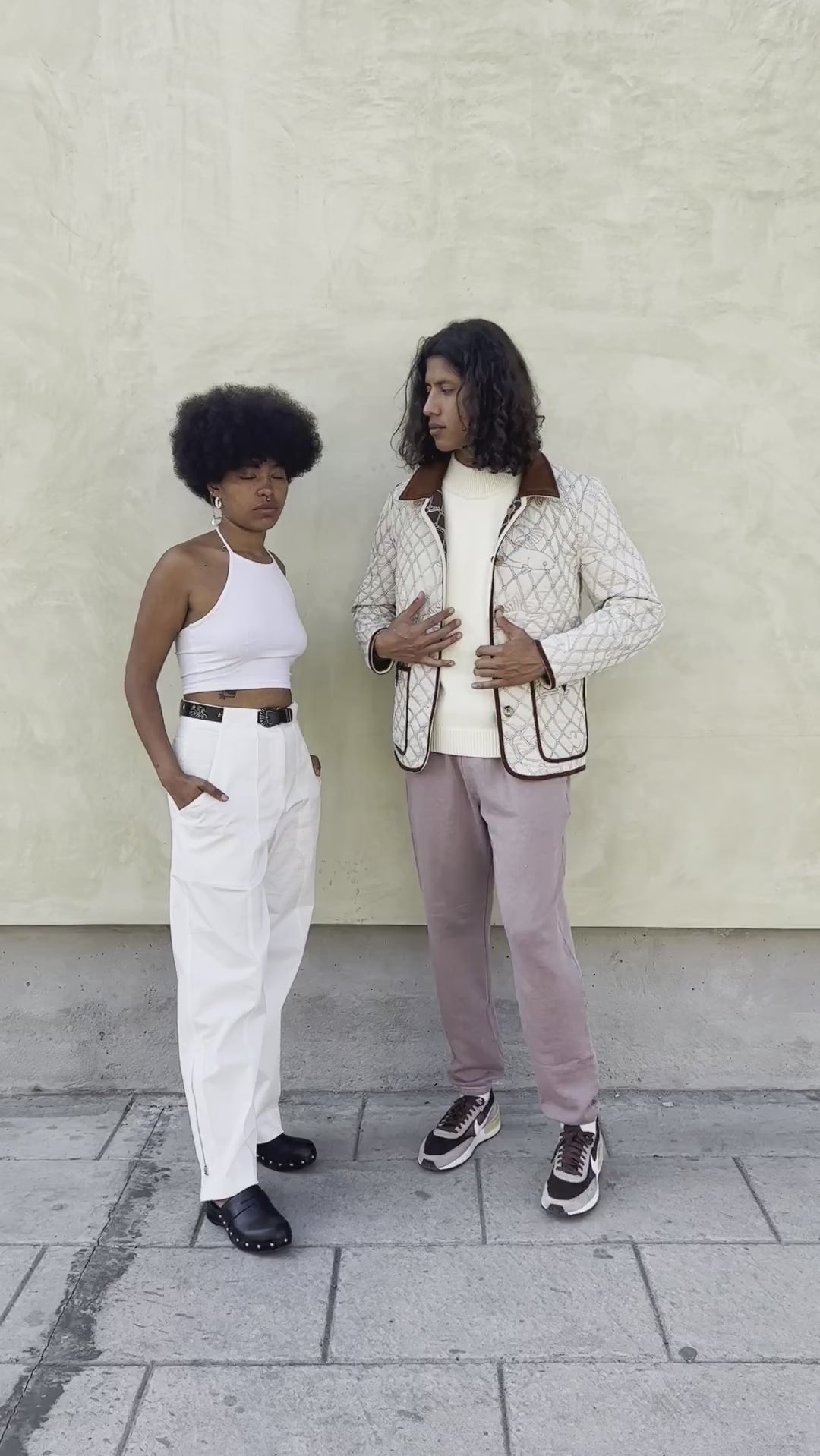 Video of man taking off reversible quilt and putting it on woman