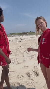 Video cutting between man and woman on the beach trying on different items from the Tombolo Wesselmann collection