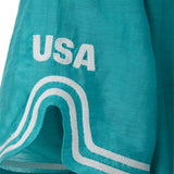 Teal blue shirt with white embroidery and white 'USA' logo patch.